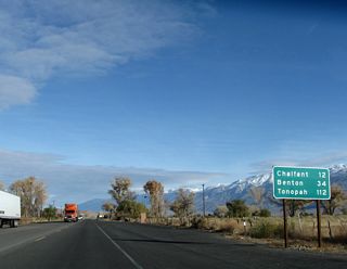 After departing from U.S. 395 within the city of Bishop, eastbound (northbound) U.S. 6 proceeds past this mileage sign, which provides the distance to Chalfant (12 miles), Benton (California 120, 34 miles), and Tonopah (112 miles). U.S. 6 was signed as north-south in California until the early 2000s, when it was changed to east-west to match the primary orientation of the national route. However, it is primarily north-south in California, even its remaining segment northeast of Bishop.