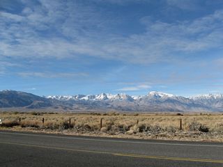 The scenic White Mountains rise above U.S. 6 and the Chalfant Valley. The White Mountains, which are part of the Inyo National Forest, feature the Ancient Bristlecone Pine Forest and some of the oldest living things on the planet. Blanco Mountain (el. 11,278 feet) and other similar peaks are visible from U.S. 6.