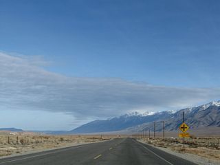 Northbound (eastbound) U.S. 6 approaches Jean Blanc Road after the MILE 5 marker.