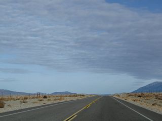 The next major intersection along U.S. 6 is with Pumice Mill Road. Due to the geologically active nature of the area, remnants of a more volcanic past are evident throughout the Eastern Sierra, especially near Bishop and Mammoth Lakes. The overlook in the third photo looks north after the MILE 9 marker.