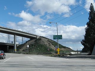 The former split of U.S. 6-99 with California 7. From this point, California 7 used to travel south on Sepulveda Boulevard parallel to Interstate 405 toward West Los Angeles and Los Angeles International Airport (LAX). California 7 was decommissioned in favor of Interstate 405, but its original alignment remains largely intact along Sepulveda Boulevard. However, this segment of Old Sepulveda Boulevard is discontinuous with the rest of Sepulveda Boulevard due to adjacent development. Stay left for the continuation of U.S. 6 and U.S. 99 south on San Fernando Road.
