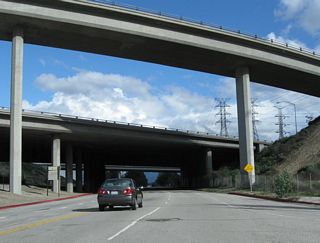 After splitting from Sepulveda Boulevard, southbound Historic U.S. 6-U.S. 99 pass under the Interstate 5 and Interstate 210 interchange.