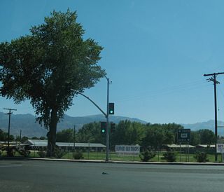 Westbound U.S. 6 meets U.S. 395 at this traffic signal; historically U.S. 6 turned south here to follow U.S. 6-395 along the Eastern Sierra to a split near Inyokern (now California 14). The Grand Army of the Republic Highway turns south onto U.S. 395 (Three Flags Highway) en route to Los Angeles. At the California 14 split near Inyokern, the Grand Army of the Republic Highway and Historic U.S. 6 travel southwest toward Lancaster, Palmdale, Santa Clarita, and Los Angeles, while U.S. 395 (Three Flags Highway) aims southeast toward Hesperia and San Bernardino.