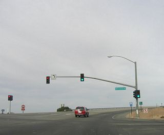 Northbound California 7 reaches the intersection with Menvielle Road. After passing the Carr Road intersection, Menvielle Road travels north to California 98 on an alignment parallel to California 7.