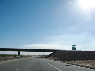 Leaving the Interstate 8 interchange, this is the first reassurance shield for California 7 south. California 7 is grade separated from Hunt Road (which changes into Chick Road a few miles west of here).Imperial Irrigation District power linescross California 7 south of the overpass.