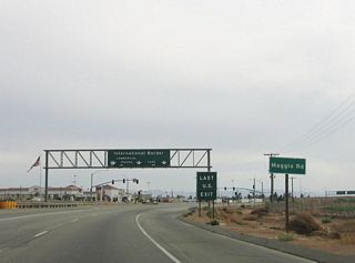 The next traffic signal along southbound is with Maggio Road. Motorist services, such as food and gas, are available at the southeastern corner of this intersection. While the sign says this is the last U.S. Exit, that might be referring to the split between commercial and private vehicles (see interchange in the background). Maggio Road connects to north-south Rood Road to the east.