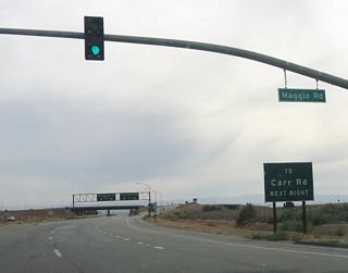 At this somewhat odd interchange, southbound California 7 exits from itself, since only trucks may use the left two lanes. These two lanes lead to the commercial port of entry and the international border with Mexico. The mainline of California 7, which is open to passenger vehicles only, exits to the right, but signage of California 7 continues on the passenger car lanes.