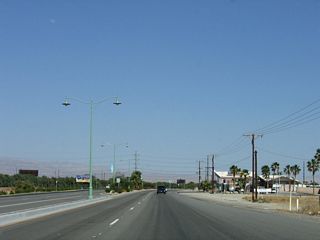 Antique-style street lights line the center median of Indio Boulevard.