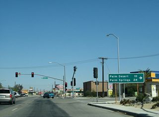 The distance sign referencing old SR 111 west to Palm Desert and Palm Springs was replaced in kind between 2006 and 2008. SR 111 historically overlapped with Business Loop I-10 (Indio Boulevard) east for 1.3 miles to Dillon Road in Coachella.