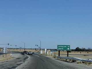 Jefferson Street continues south from a signalized intersection with Indio Boulevard to La Quinta.