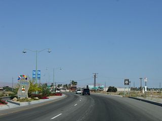A welcome monument sign proclaiming Indio to be the "City of Festivals" appears within the landscaped median along Indio Boulevard east of Jefferson Street.
