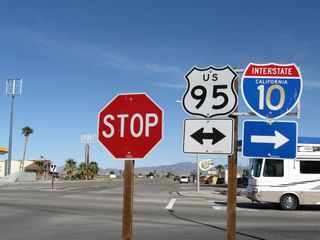Historic U.S. 60-70 (Hobson Way) meets U.S. 95 (Intake Boulevard) at this stop sign. U.S. 95 travels north from Intertate 10 at Blythe to Vidal Junction and Needles. The highway south overlaps with I-10 east to Quartzsite, Arizona.
