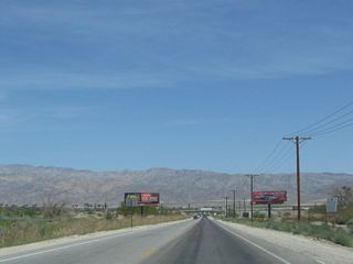 Beyond the the Dillon Road Grade Separation on the border between the cities of Indio and Coachella in the Coachella Valley, Dillon Road intersects Cabazon Avenue north and Avenue 48 east. The unsigned business loop then reduces to two lanes ahead of the Whitewater River.