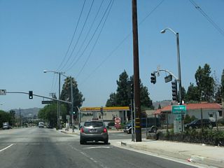 A loop ramps follows from Holt Avenue west for SR 71 (Chino Valley Freeway) southbound. Humane Way leads south from the signalized intersection to Mission Boulevard. Holt Avenue ends and Valley Boulevard begins at this point as well. Valley Boulevard is not an old U.S. highway alignment, but it offers an alternate route through western Pomona into Walnut and the City of Industry.