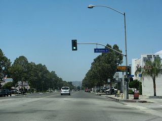 Dudley Street ties into Holt Avenue north of an industrial park area.