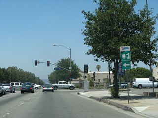 Garey Avenue leads to the Amtrak and Metrolink rail station. Both passenger rails run along the Union Pacific Railroad, which parallels Holt Avenue to the south.