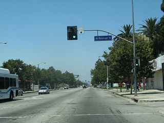 The next signalized intersection along westbound Business Loop I-10 (Holt Avenue) is with Reservoir Street.