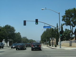 Westbound Business Loop I-10 (Holt Avenue) meets White Avenue at this traffic signal.