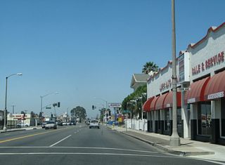 Passing Fern Avenue, Holt Boulevard accommodates four through lanes as well as parking and turn pockets.