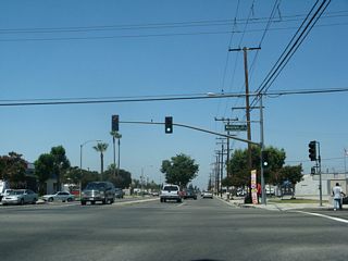 Westbound Business Loop I-10 (Holt Boulevard) intersect Mountain Avenue at this traffic signal.