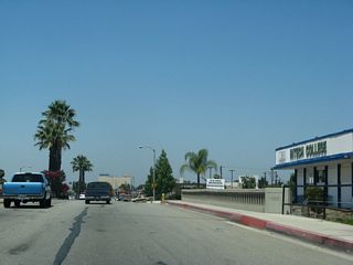 With divoted curbing and old concrete bridge rail, a 1939 bridge takes Business Loop I-10 (Holt Boulevard) over San Antonio Channel. This bridge was originally in service as part of U.S. 70-99.