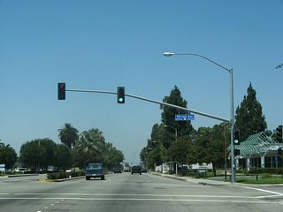 Westbound Business Loop I-10 (Holt Boulevard) meets Vernon Avenue at this traffic signal.