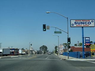 Westbound Business Loop I-10 (Holt Boulevard) intersects Vine Avenue at this traffic signal.