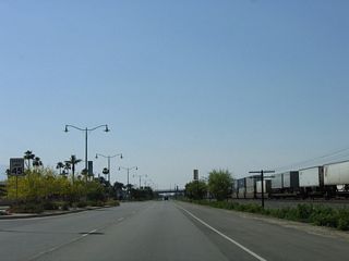 Landscaping lines the median of Indio Boulevard as it advances northwest.