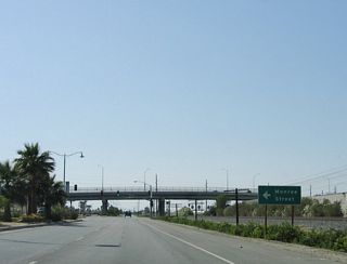 Fred Waring Drive stems west from Indio Boulevard to connect with Monroe Street south of the viaduct spanning Historic U.S. 60/70/99 and the UP Railroad. The bridge was built in 1990.