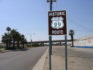 Highway 111 branches west from Indio Boulevard ahead of the Golf Center Parkway viaduct. A Historic U.S. 99 sign followed the separation. It was removed by 2012.