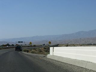 The bridge taking Indio Boulevard north across the Union Pacific Railroad was built in 1936. The companion spans along Indio Boulevard eastbound was built in 1956.