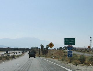The direct ramp onto I-10 west from Indio Boulevard was replaced with a loop ramp from the realignment of Jefferson Street.