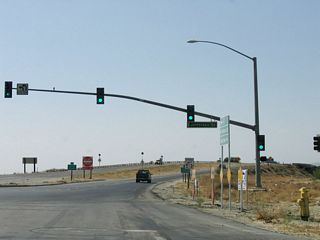 Curving northwest, Indio Boulevard meets Jefferson Street. Historically due to the proximity of I-10 and the Union Pacific Railroad, the northern segment of Jefferson Street was not accessible from here. That changed with 2015-17 construction of a new parclo interchange with Interstate 10.