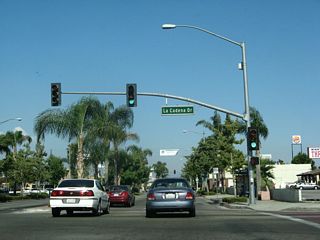 Eastbound Valley Boulevard (Business Loop I-10) meets La Cadena Drive at this traffic signal.