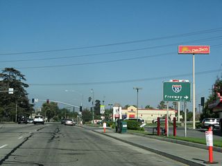 Valley Boulevard east intersects Rancho Avenue in Colton just north of the diamond interchange along Interstate 10 at Exit 70 A. This button copy sign was replaced in kind by 2019.