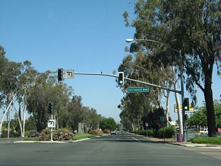 Northbound Business Loop I-15 (Centre City Parkway) meets Thirteenth Avenue at this traffic signal. The reassurance marker posted afterward was removed by 2012.