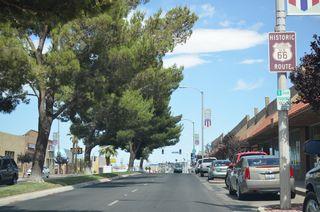 A tree lined median separates traffic along Main Street between 2nd Avenue and Barstow Road.
