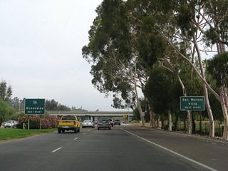 A half cloverleaf interchange joins northbound Business Loop I-15 with SR 78 west to Vista and San Marcos.