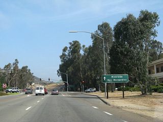 0.4 miles beyond the traffic signal with Country Club Lane, Business Loop I-15 converges with Interstate 15 north.