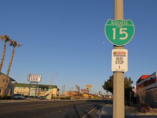 Business Loop I-15 curves southeast back to I-15 between Murial Drive and Yucca Avenue.