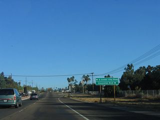 An access road llinks Centre City Parkway with S Centre City Parkway and S Escondido Boulevard, frontage roads for Business Loop I-15. Escondido Boulevard is the original route of U.S. 395 through Escondido; Centre City Parkway was built as the expressway bypass of Downtown Escondido.