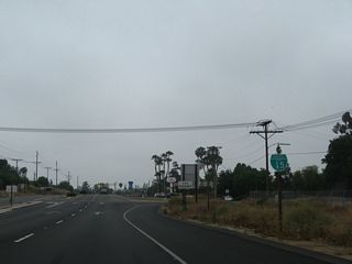 What was the first business loop route marker preceded the intersection with Escondido Boulevard. The shield was removed by 2012.