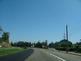 S Escondido Boulevard diverges from Business Loop I-15 (Centre City Parkway) north of Brotherton Road.