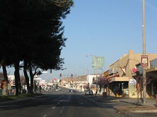 Historic U.S. 66 is signed along Main Street west of N 3rd Avenue in Downtown Barstow.