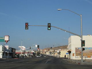 Business Loop I-15/Historic U.S. 66 (Main Street) continue west to the signalized intersection with N 2nd Avenue.