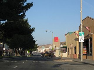 A tree lined median separates traffic along Main Street west between Barstow Road and 2nd Avenue through Downtown Barstow.