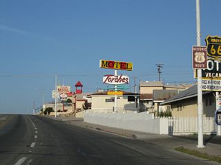 A vintage sign for the Route 66 Motel along Main Street westbound ahead of Dillingham Drive.