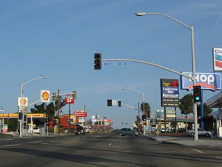 The confluence of signalized intersections with Coolwater Lane south, Eastgate Road east and Mountain View Street west line a commercialized stretch of E Main Street populated by traveler services.