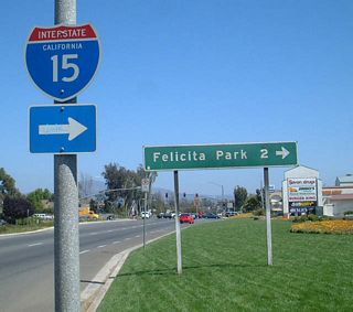The guide sign for Felicita Park was replaced by 2009 with a sign referencing Felicita Avenue. Felicita Avenue angles southwest from Montview Drive to Interstate 15 at Gamble Lane west and Citracado Parkway east. Felicita County Park lies further south of the Escondido Freeway along Felicita Creek.