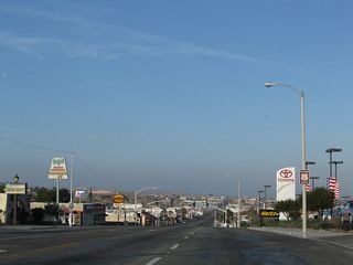Historic U.S. 66 sign posted along Main Street west at May Avenue.